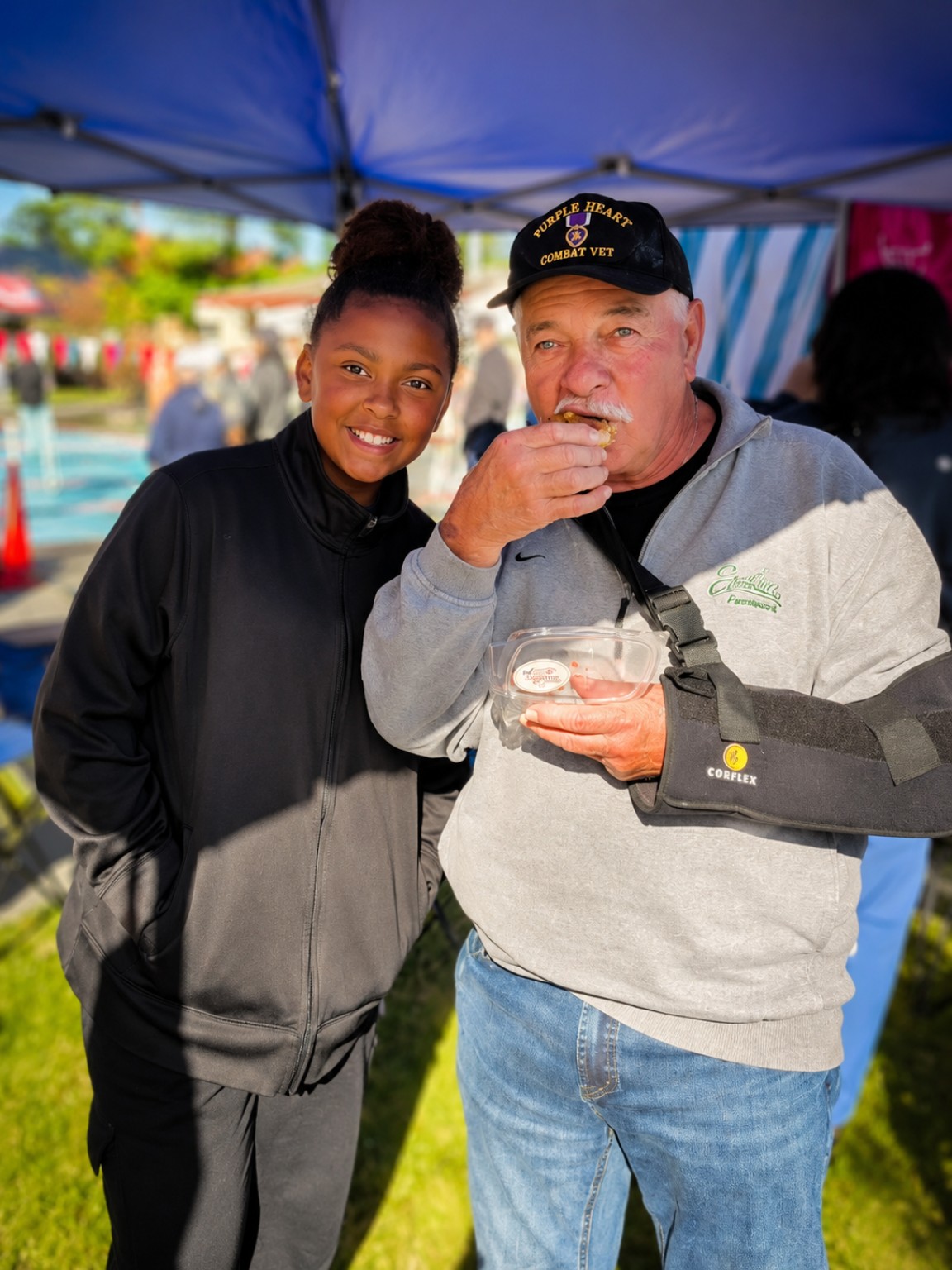 Phoenix purple heart veteran Robert Rodriguez eating sticky peach cobbler cookie